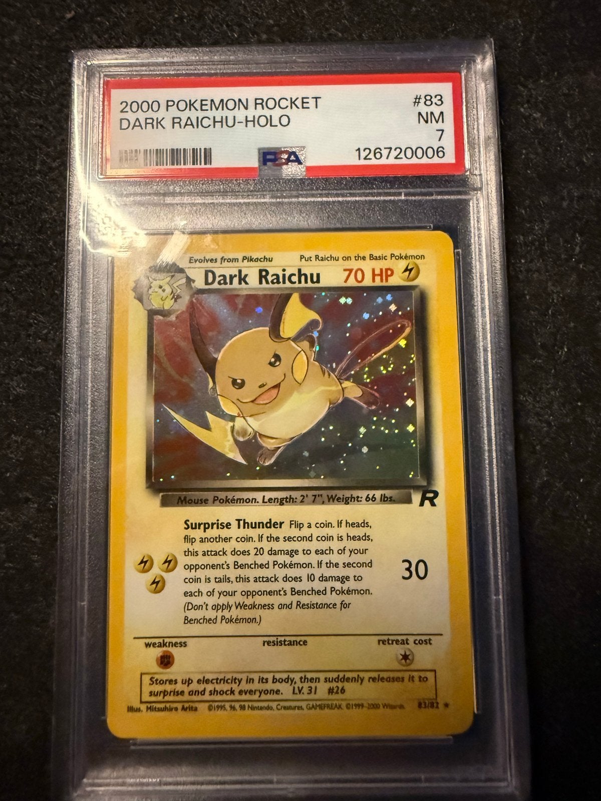 2000 Pokémon Rocket Dark Raichu Holo PSA 7 NM, Ophalen of Verzenden, Zo goed als nieuw, Losse kaart, Foil