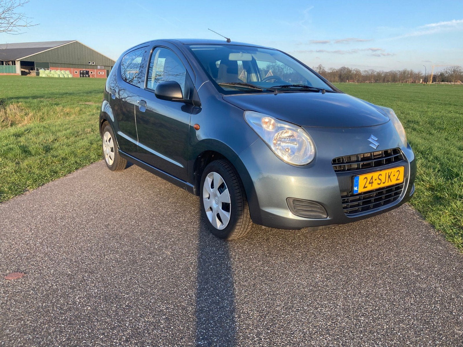 Suzuki Alto 1.0 2011 Grijs lage km-stand, Auto's, Suzuki, Voorwielaandrijving, 200 kg, 4 stoelen, Origineel Nederlands