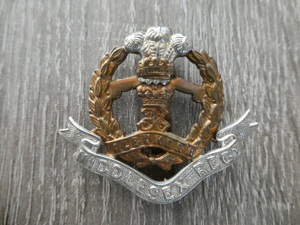 Cap badge Middlesex Regiment., Ophalen of Verzenden, Landmacht, Engeland, Embleem of Badge