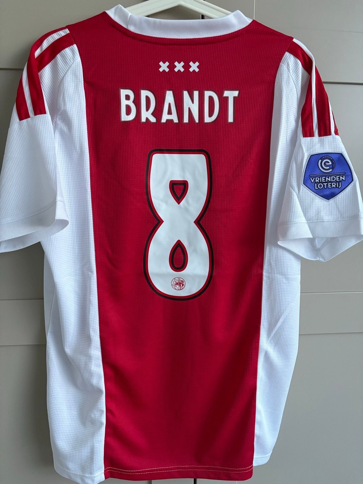 Ajax Thuisshirt Brandt Large Seizoen 26/27 Adidas Nieuw, Maat 52/54 (L), Nieuw, Ophalen of Verzenden, Voetbal