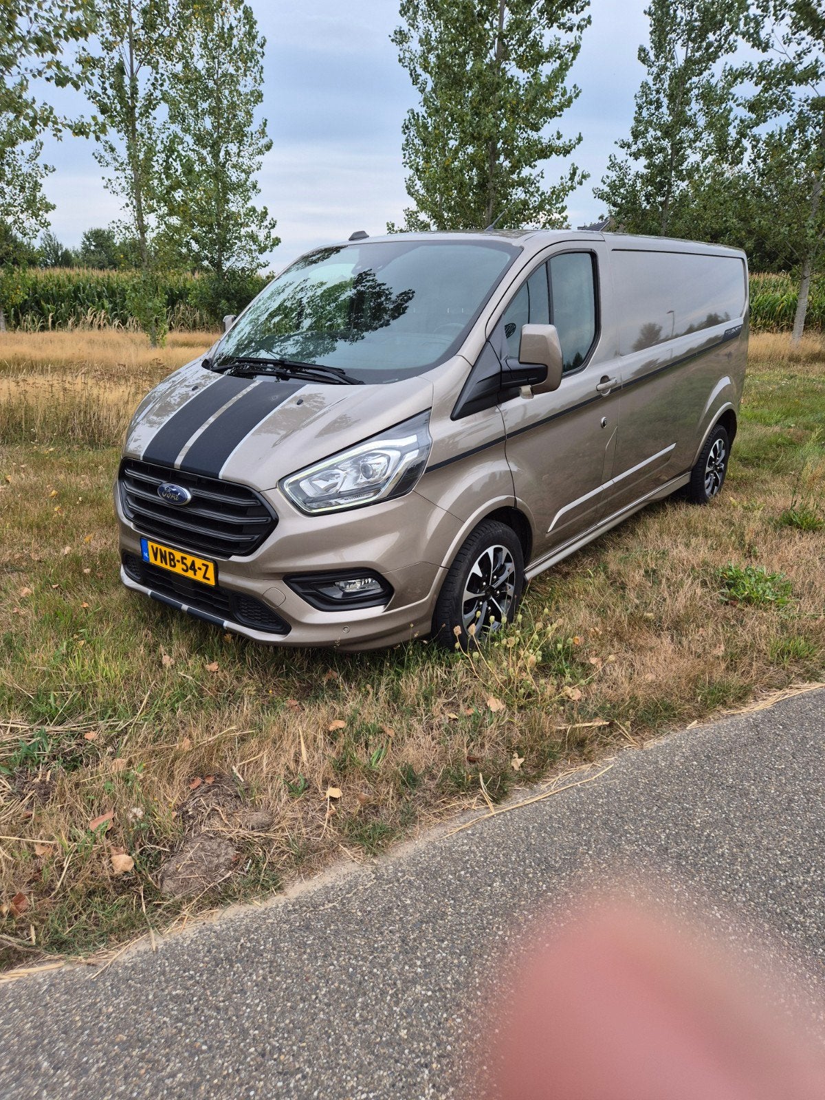 Ford Transit Custom GB 2.0 Tdci 185PK 320 L2h1 2021 Grijs, Auto's, 1995 cc, 4 cilinders, Parkeerassistent, Leder en Stof