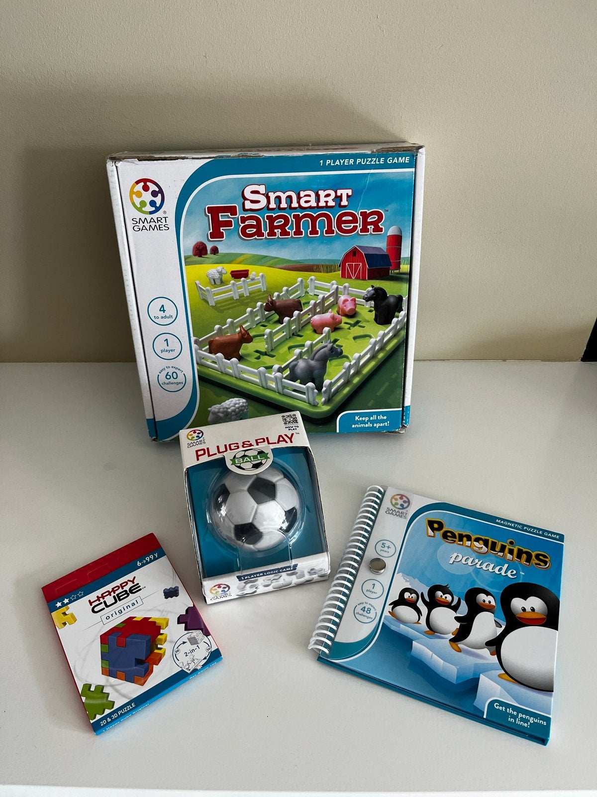 SmartGames Puzzelspellen: Smart Farmer, Penguins Parade, Hap, Een of twee spelers, Ophalen, Gebruikt
