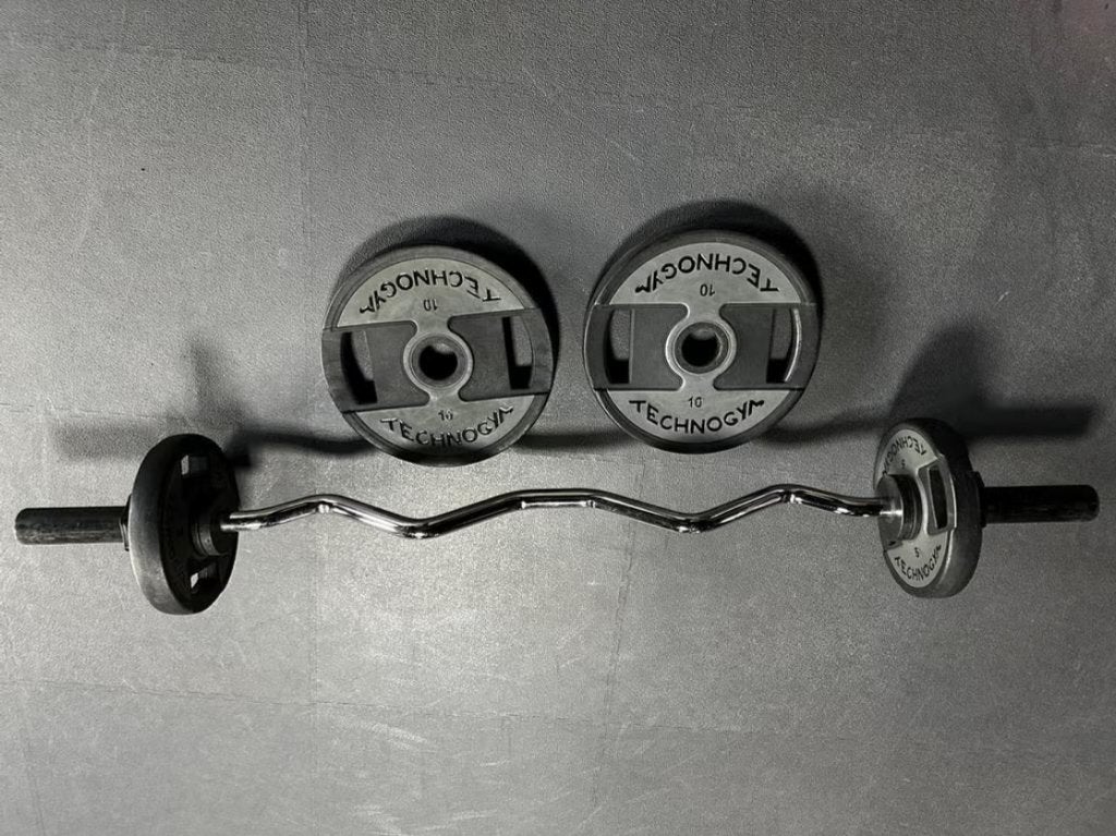 Technogym curl EZ Fitness-bar inclusief 70 kg, Ophalen of Verzenden, Zo goed als nieuw, Benen, Halterset