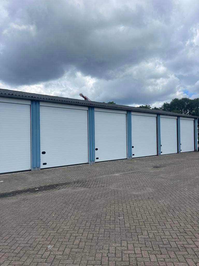 Nieuwe en gebruikte garagedeur, roldeur, industriedeur deur, Ophalen of Verzenden, 120 cm of meer, Garagedeur, 215 cm of meer