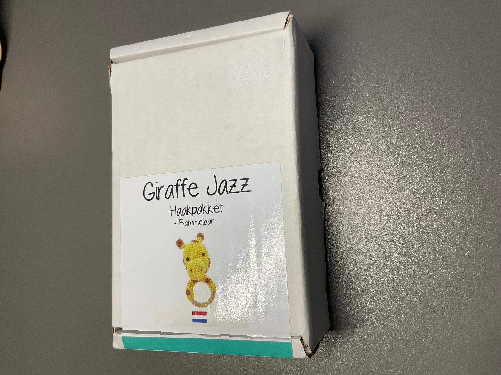 Giraffe Jazz haakpakket rammelaar, Hobby en Vrije tijd, Ophalen of Verzenden, Zo goed als nieuw, Haken, Wol of Garen