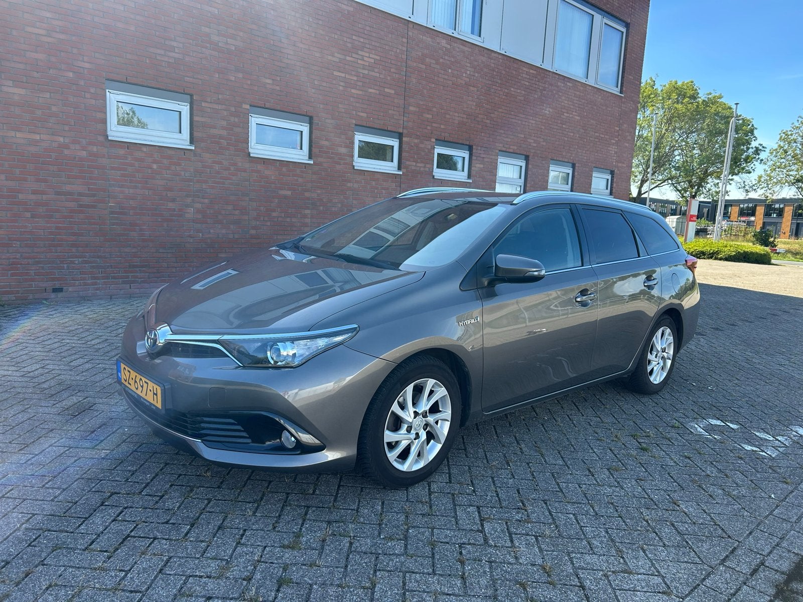 Toyota Auris 1.8 Hybrid Touring Sports CVT 2018 Bruin, 28 km/l, Bruin, Stationwagon, Te koop
