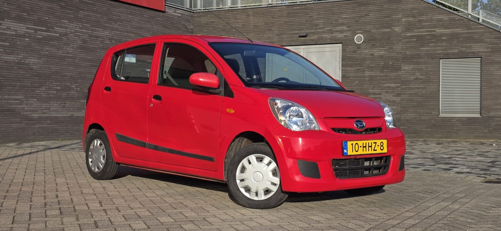 Daihatsu Cuore 1.0 5D AUT 2008 Rood van eerste eigenaar, Auto's, Stof, 600 kg, 18 €/maand, 4 stoelen
