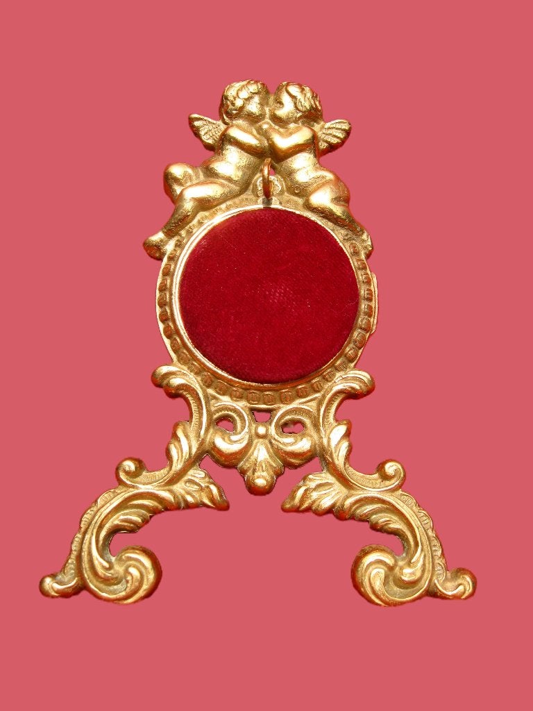 Vergulde engeltjes portemontre statief zakhorloge., Ophalen