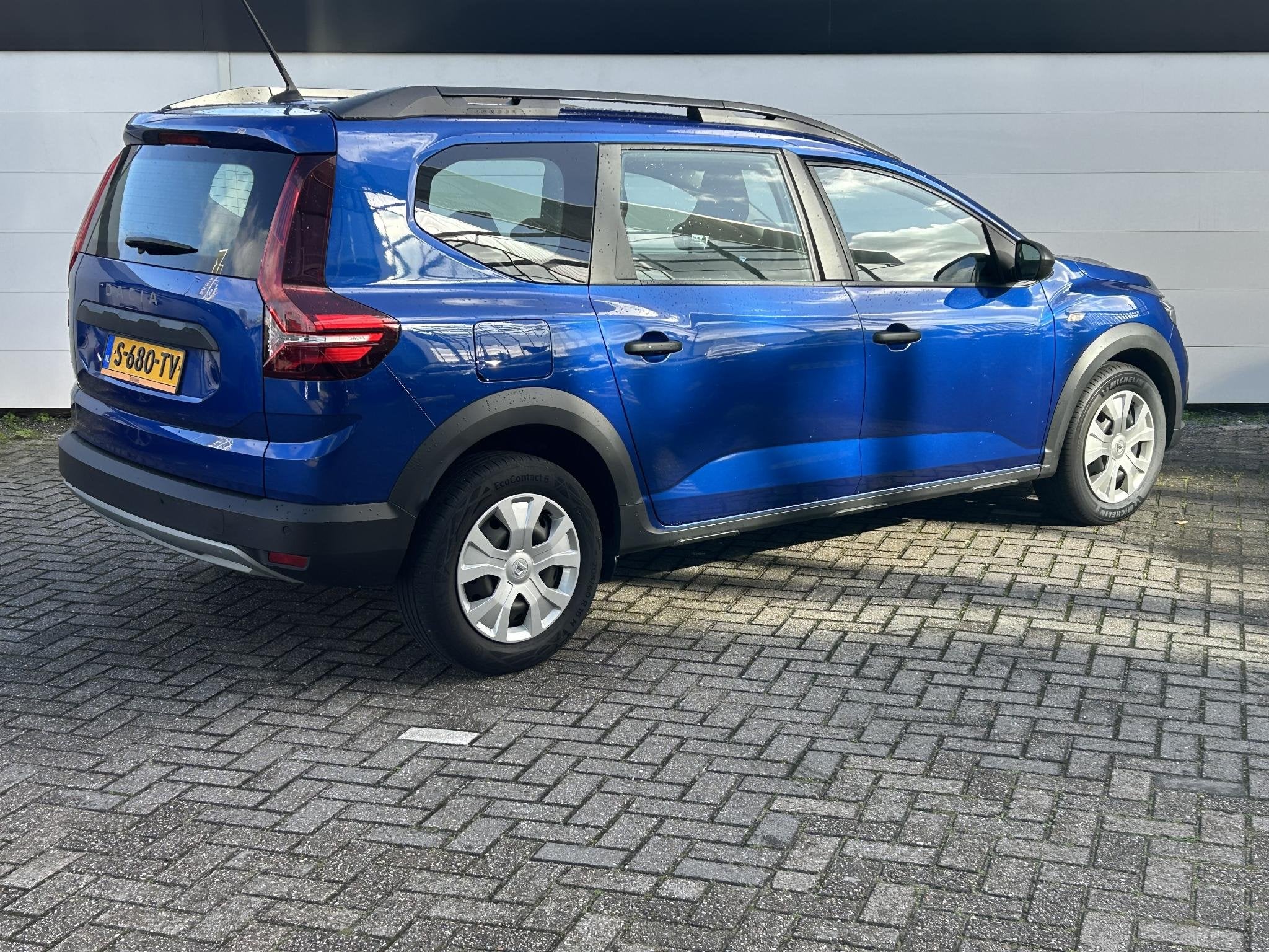 Dacia Jogger 1.0 TCe 110 Expression 5p. | Airco | Cruise Con, Auto's, Stof, Met garantie (alle), Blauw, Handgeschakeld