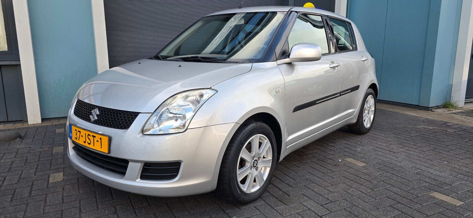 Suzuki Swift 1.3 Xpression 5D 2009 Grijs, apk,2 eigenaren, Auto's, Voorwielaandrijving, Stof, 40 €/maand, 400 kg