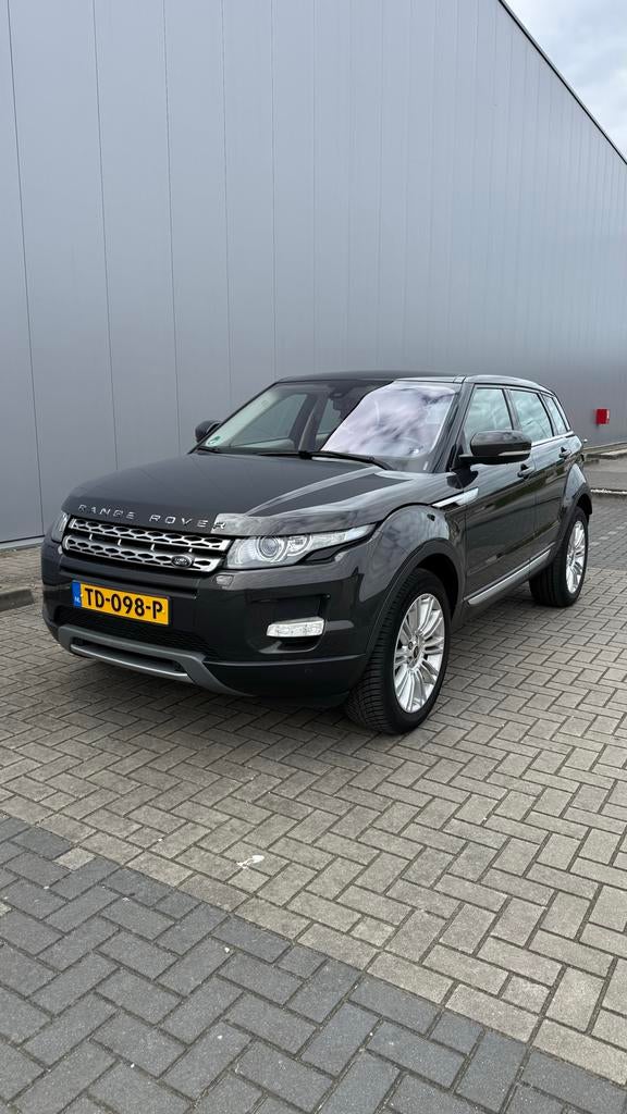 Land Rover Range Rover Evoque SI4 4WD AUT 2012 Bruin, Auto's, Automaat, Euro 5, 1800 kg, Bruin