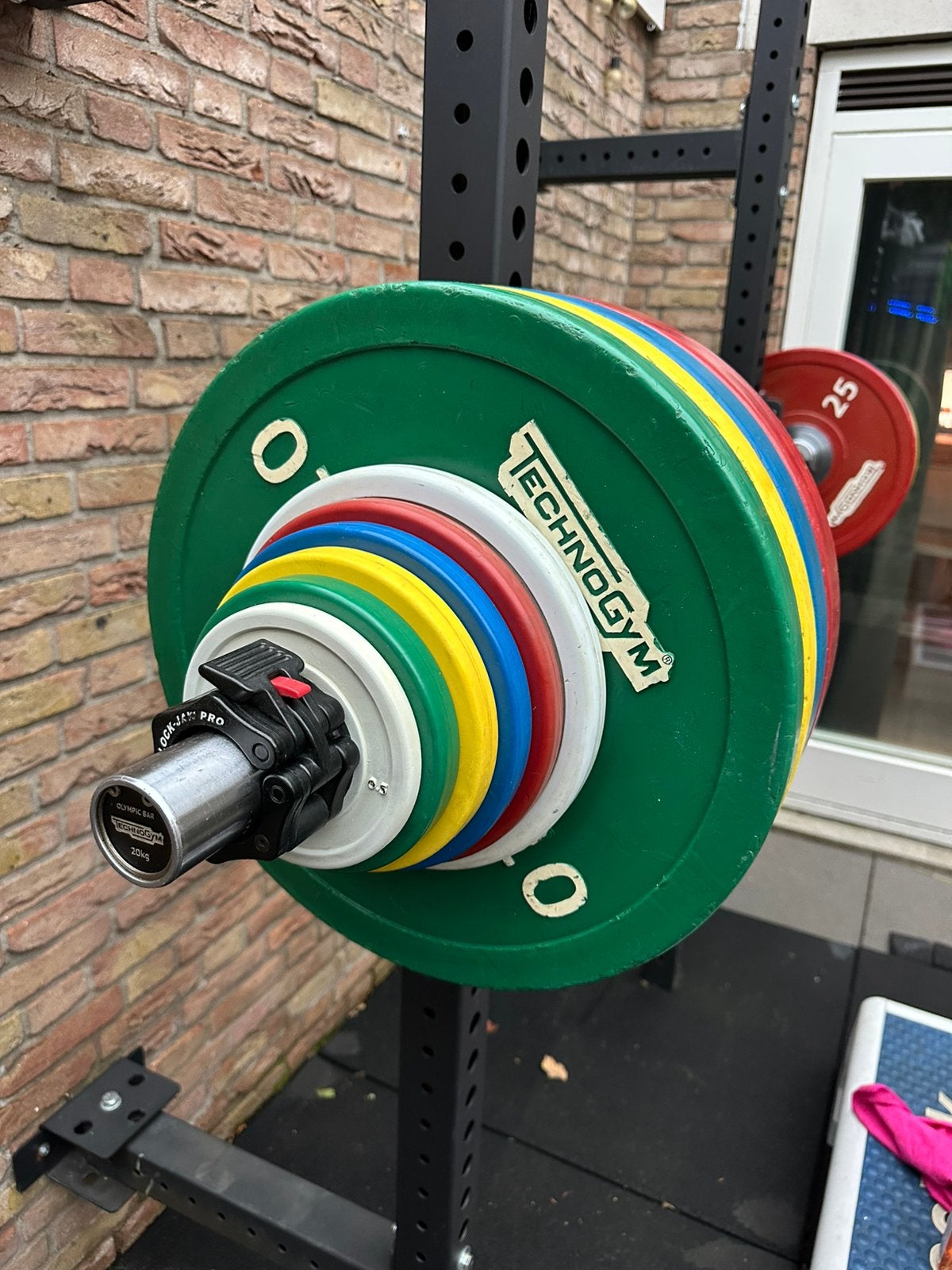 Technogym Olympic Plates 165 kg, Ophalen of Verzenden, Zo goed als nieuw, Benen, Halterschijven