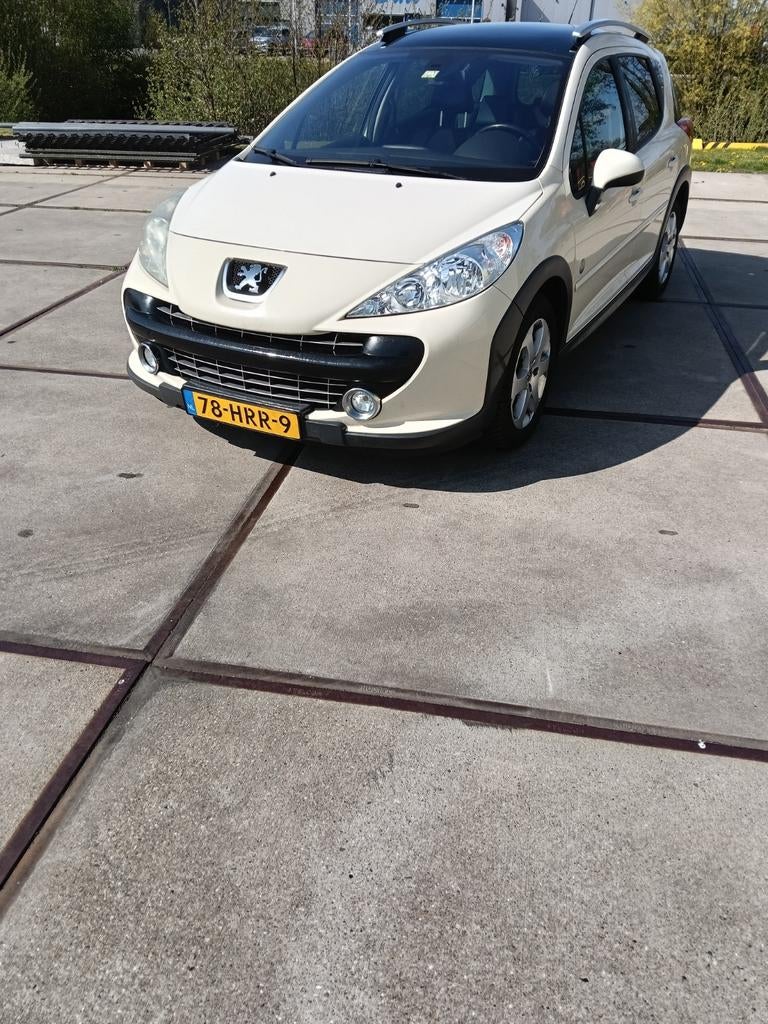 Peugeot 207 1.6 16V SW Outdoor 2009 Beige, Auto's, Zwart, 4 cilinders, Handgeschakeld, 600 kg