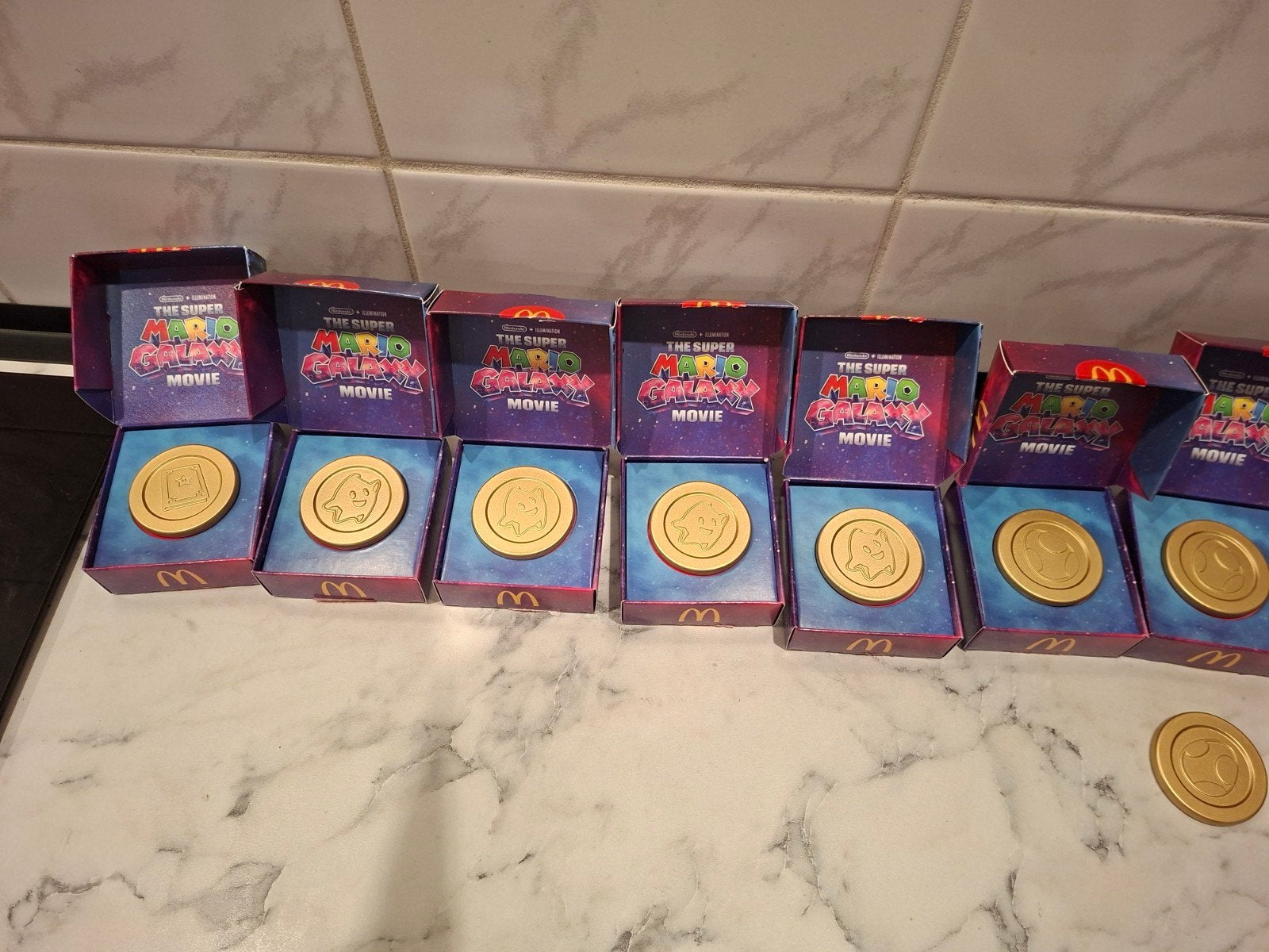 McDonald's Super Mario Galaxy Movie munten (7 stuks), Ophalen of Verzenden