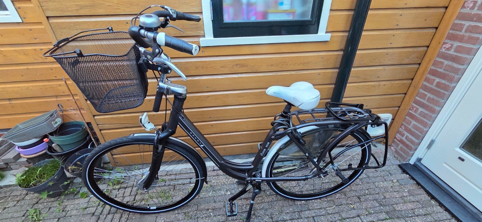 Sparta Anna One Damesfiets mandje en kinderzitje, Ophalen