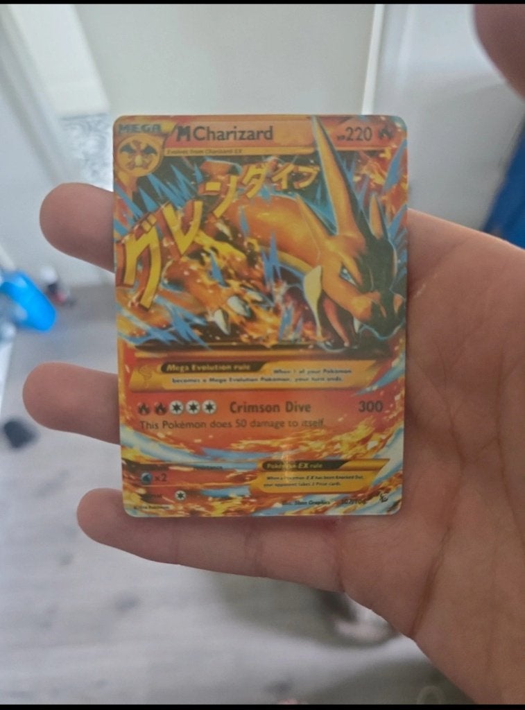 M charizard ex 107/106, Ophalen of Verzenden, Zo goed als nieuw, Losse kaart