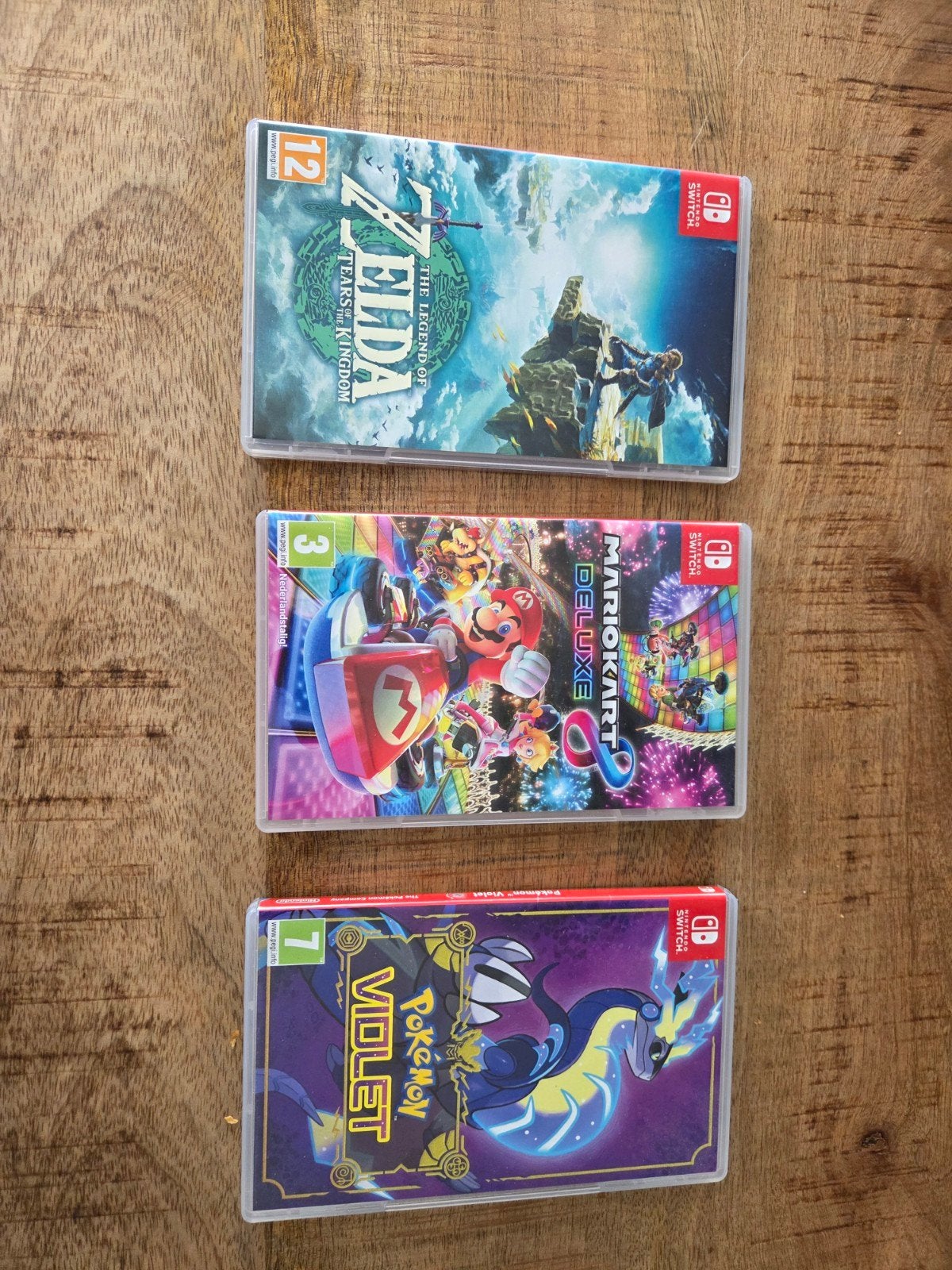 3 Nintendo Switch games: Zelda, Mario Kart 8, Pokémon Violet, Zo goed als nieuw, Eén computer, 3 spelers of meer, Vanaf 12 jaar