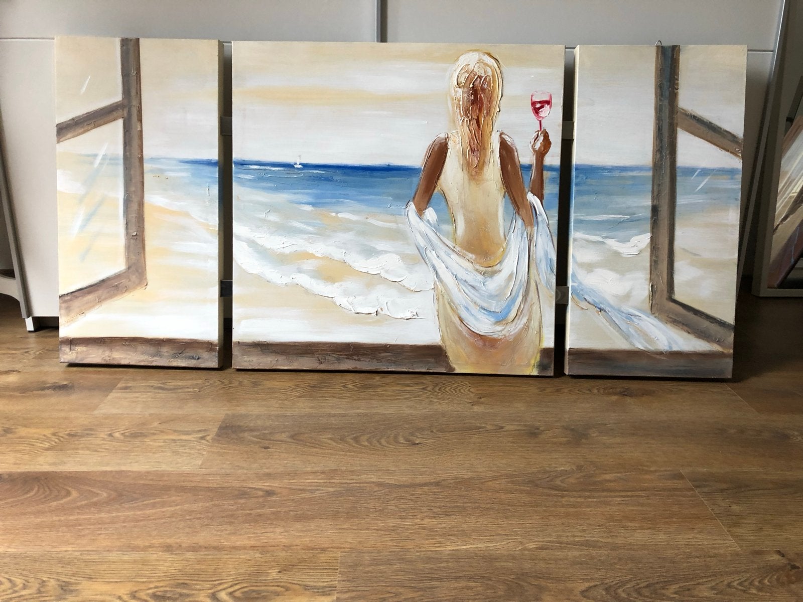 Schilderij: Vrouw met wijn aan zee (3-luik), Ophalen