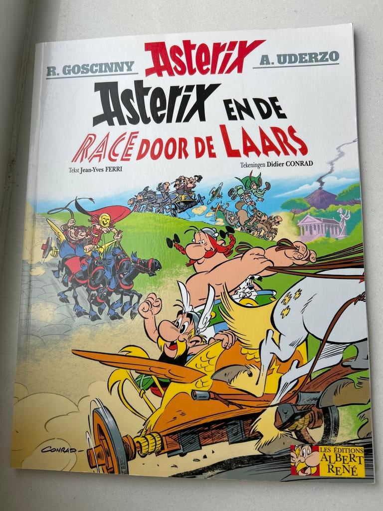 Asterix en de Race door de Laars -, Eén stripboek, Ophalen of Verzenden, Zo goed als nieuw
