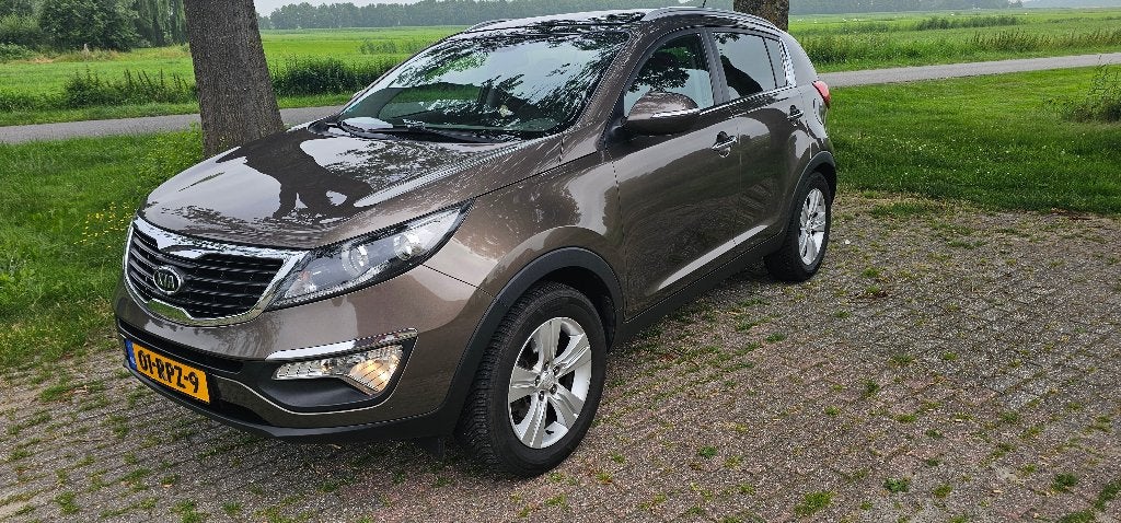 Zeer goed onderhouden Kia Sportage., 1998 cc, 730 kg, 4 cilinders, Bruin