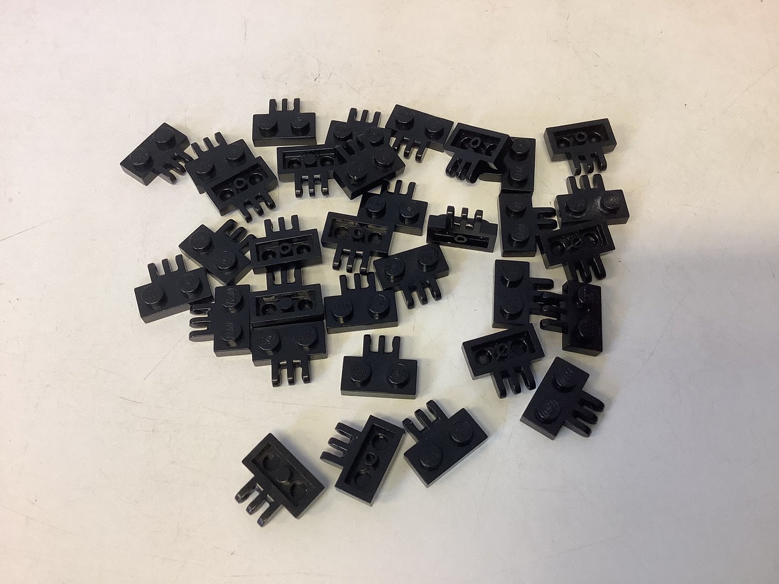 Lego scharnierplaat 1x2 met 3 vingers aan zijkant zwart, Ophalen of Verzenden, Gebruikt, Losse stenen, Lego