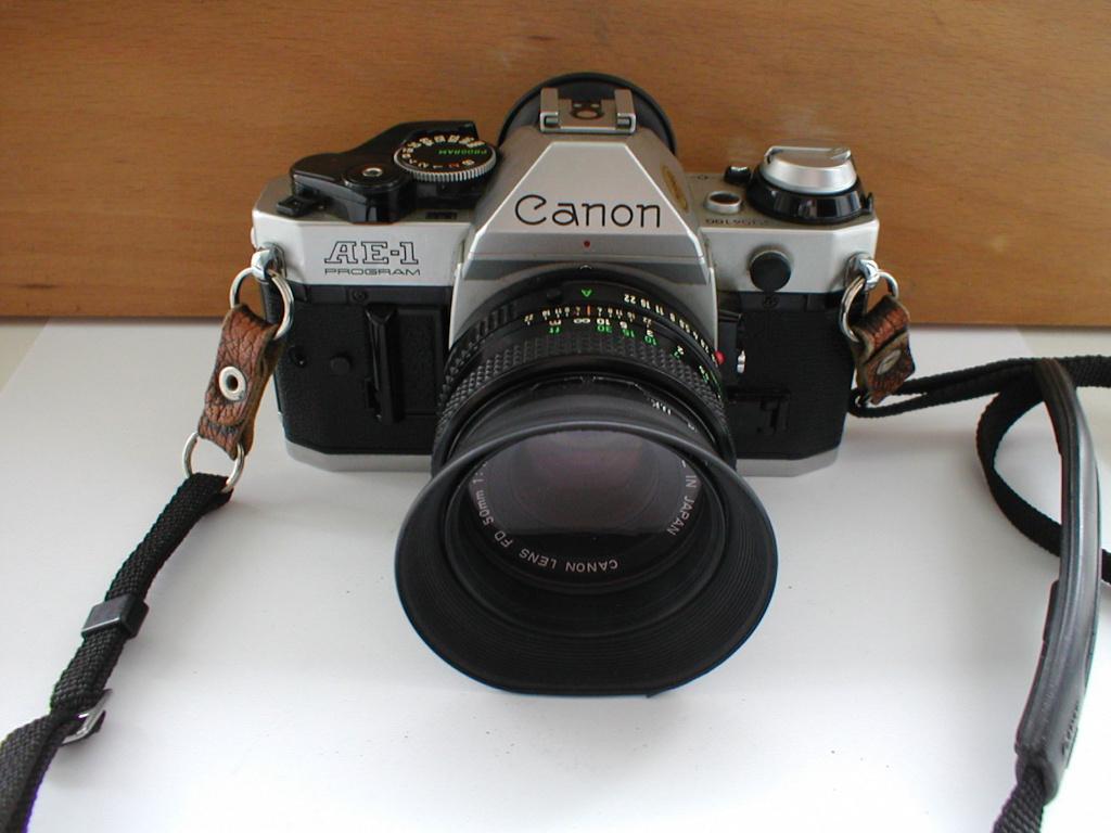 Canon AE-1 Program reflexcamera met FD 50mm F/1.8 lens, Audio, Tv en Foto, Fotocamera's Analoog, Ophalen of Verzenden, Gebruikt