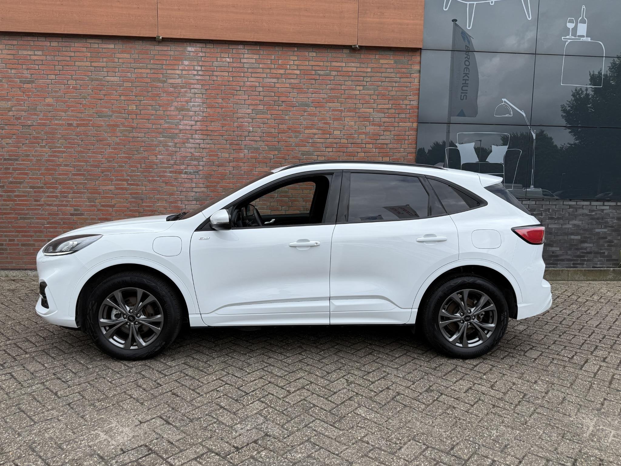 Ford Kuga 2.5 PHEV ST-Line-navi-winterpack-Frozen White, Auto's, Gebruikt, 4 cilinders, Wit, Plug-in hybride