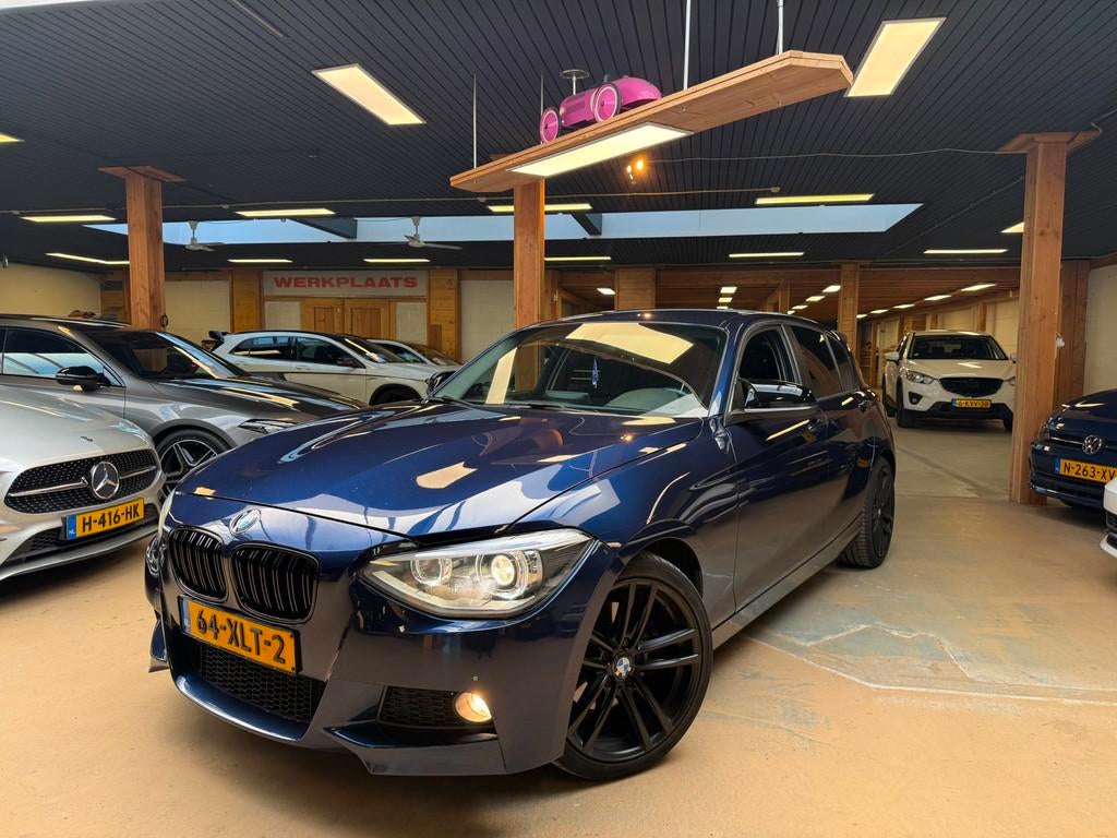 BMW 1-serie 125i Business+ M-Pakket M135i Sport Xenon Carpla, Auto's, Euro 5, Gebruikt, 4 cilinders, Blauw