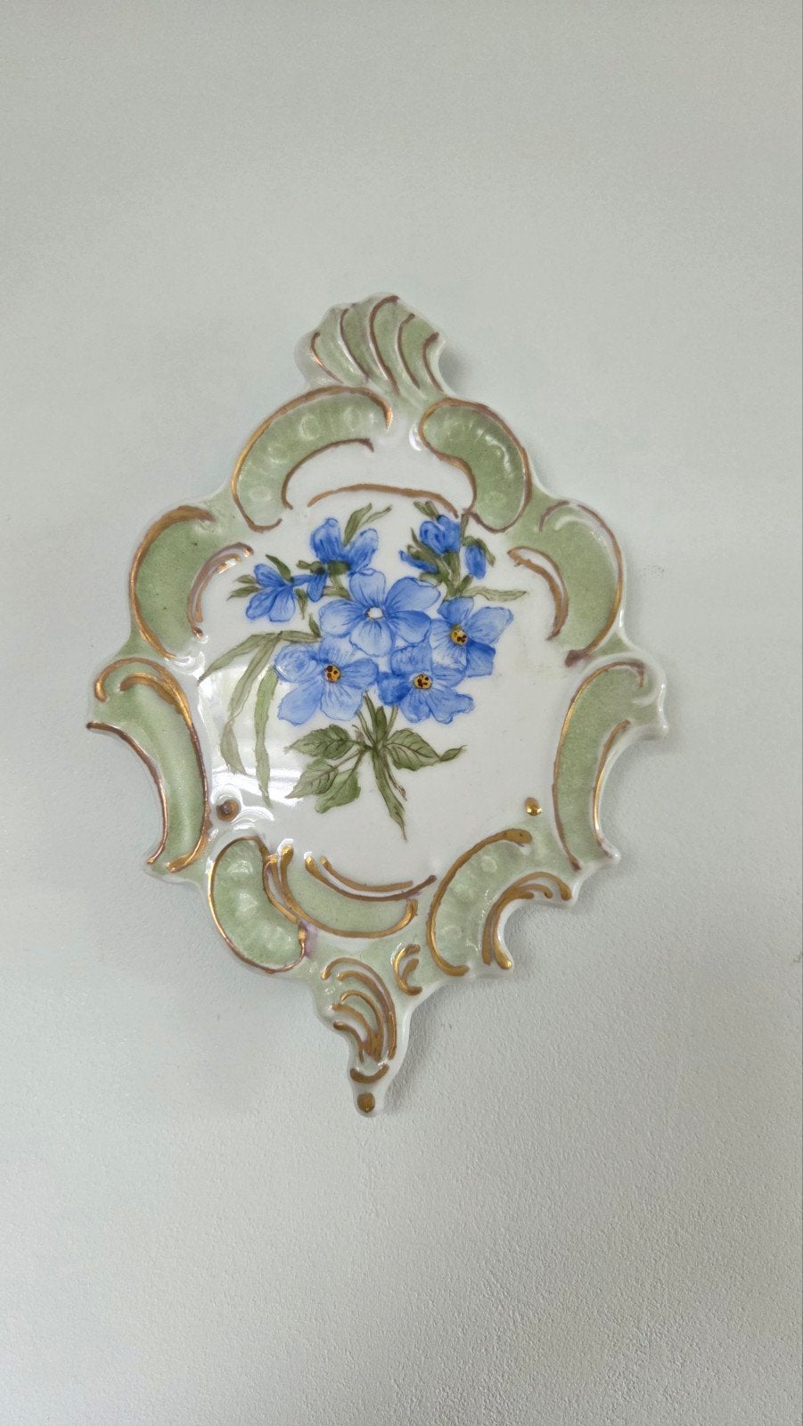 Vintage Lindner wandbordje met bloemmotief., Antiek en Kunst, Ophalen of Verzenden