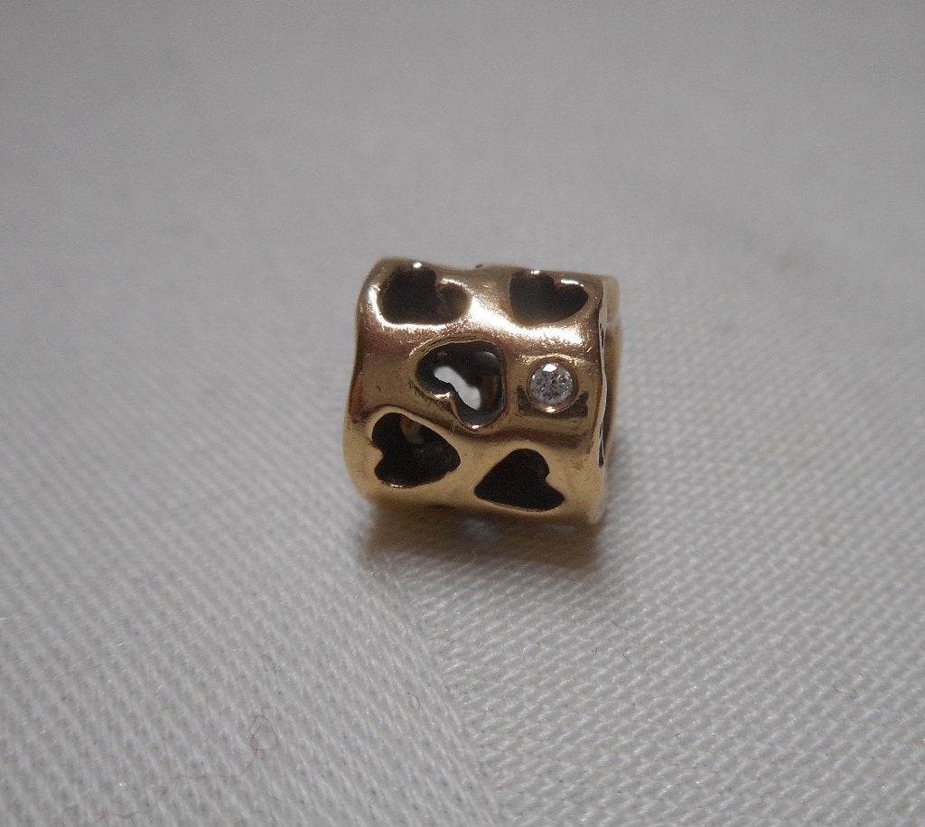 Pandora gouden bedel tunnel van liefde met diamant nr.447, Sieraden, Tassen en Uiterlijk, Verzenden, Pandora, Zo goed als nieuw