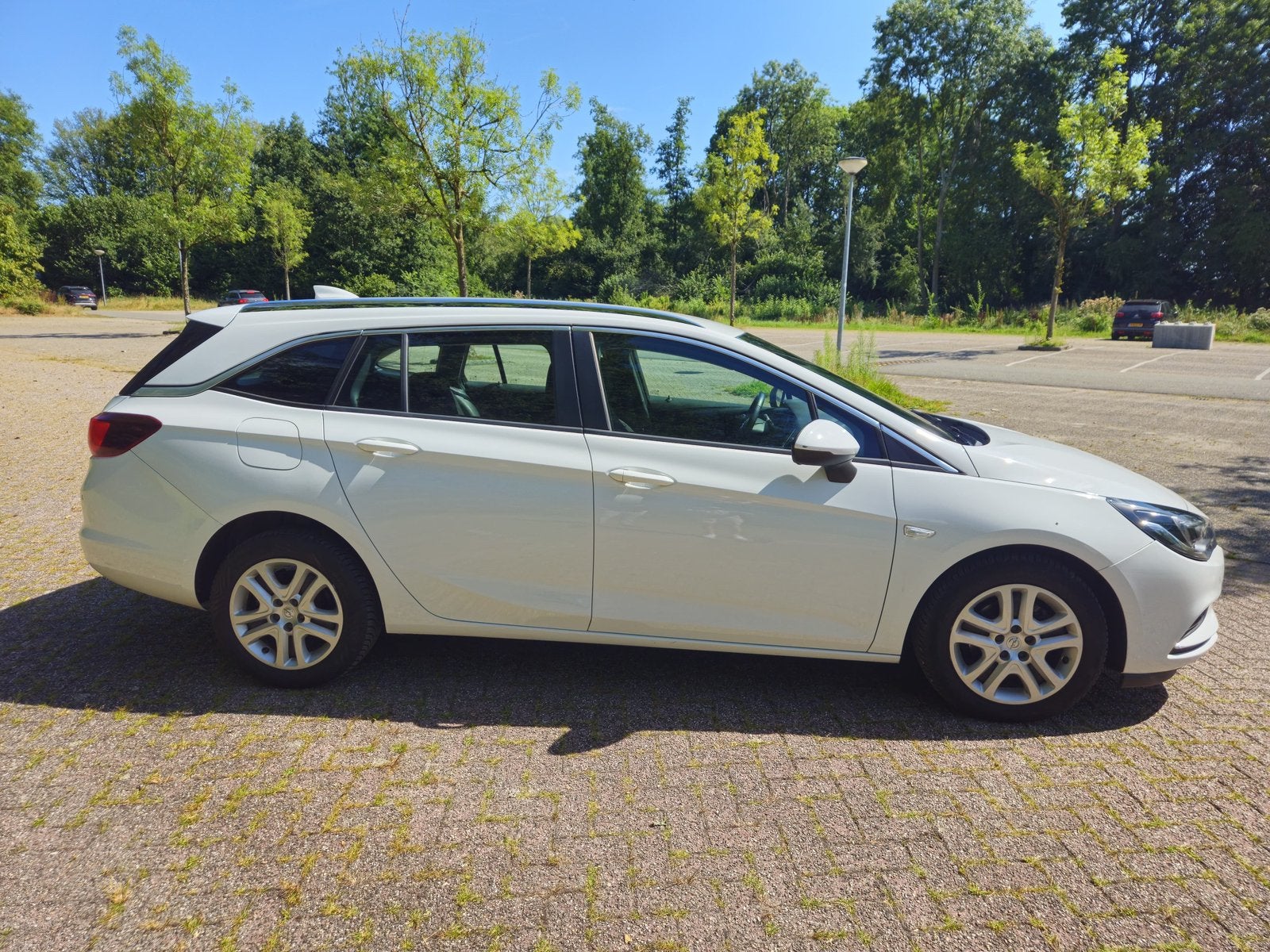 Luxe Opel Astra 1.0 Turbo Sports Tourer 2017 Wit NIEUWE APK, Voorwielaandrijving, Stof, Zwart, 1178 kg