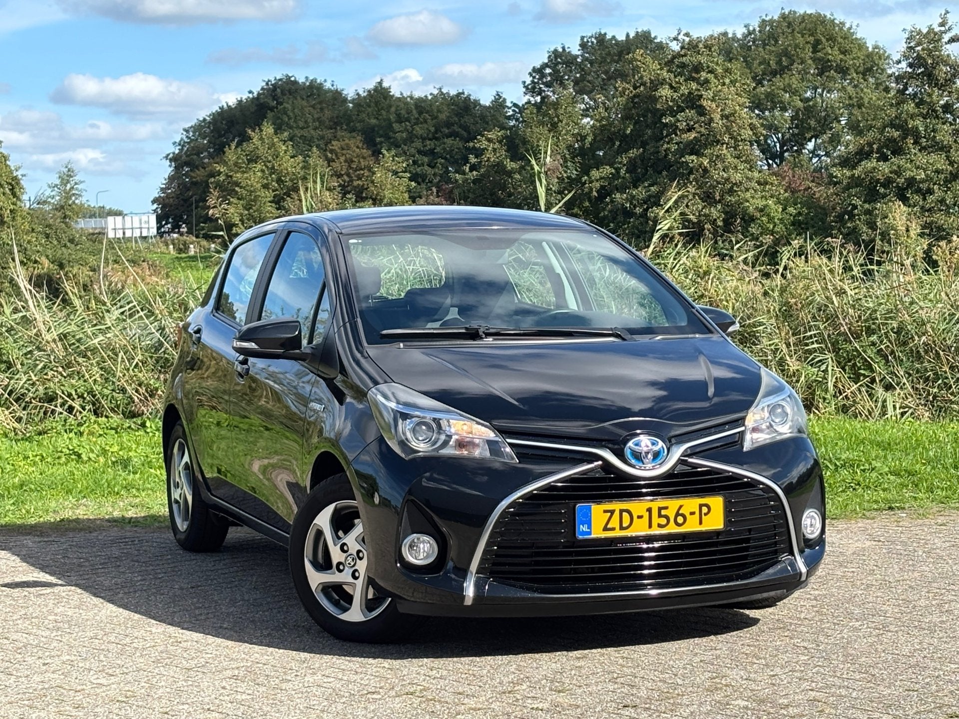 Toyota Yaris 1.5 Hybrid Trend - Black Sand Pearl - Nav/Cruis, Auto's, Gebruikt, Euro 6, 4 cilinders, Bedrijf