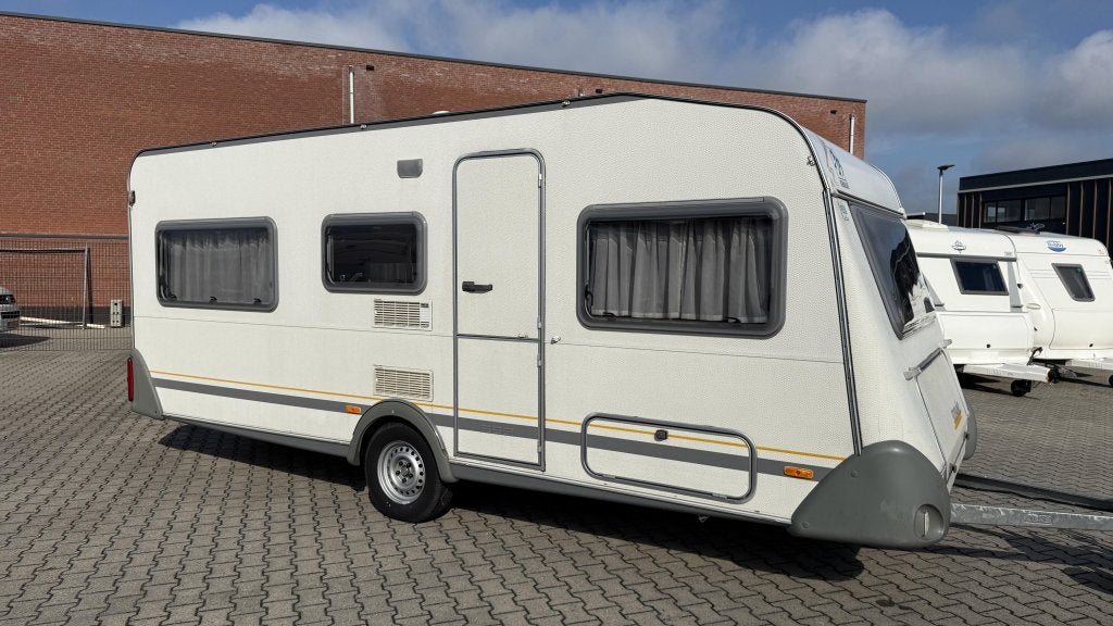 Knaus Sudwind 495 TK bouwjaar 2000 met voortent en luifel, Caravans en Kamperen, Caravans, Schokbreker, Overige typen, Bedrijf