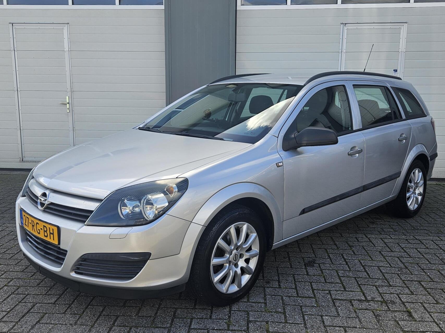 Opel Astra Wagon 1.6 Enjoy | Airco | Trekhaak, Auto's, Voorwielaandrijving, Gebruikt, Zwart, 4 cilinders