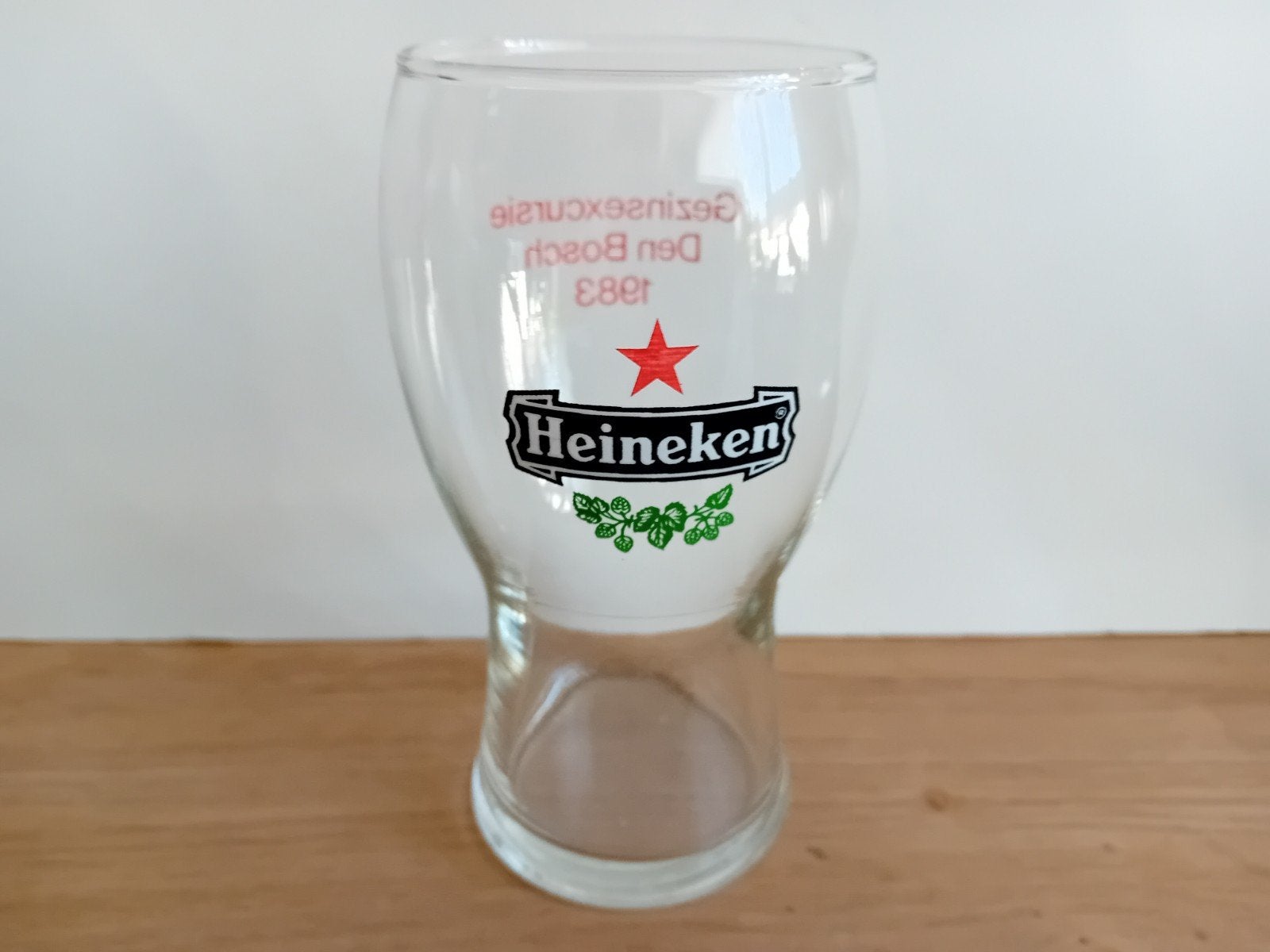 Heineken glas met achteropdruk uit 1983, Ophalen of Verzenden, Zo goed als nieuw, Glas of Glazen, Heineken