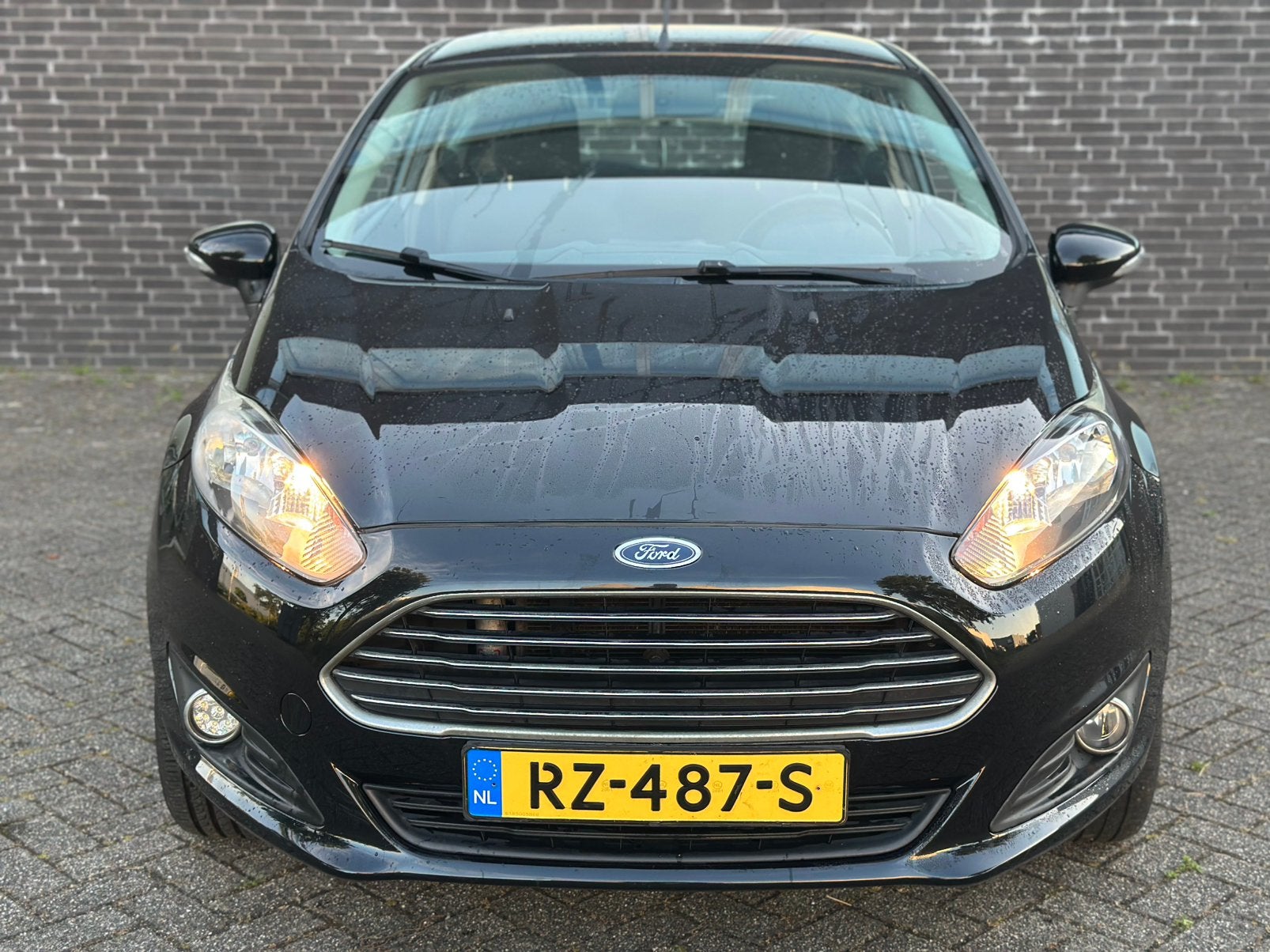 Foto 4 van Ford Fiësta 1.25 44KW 3DR 2014 Zwart/17INCH/CRPLY/NW ONDRHD