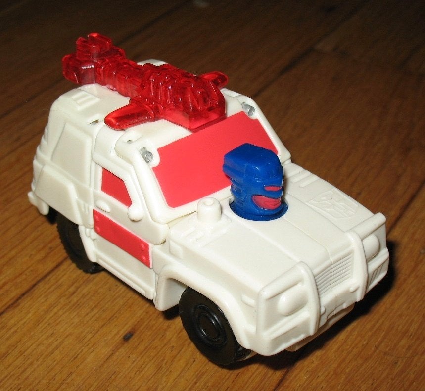 Transformers 2002 mcdonalds wit-rode auto 9x6cm, Verzamelen, Transformers, G1, Ophalen of Verzenden, Gebruikt