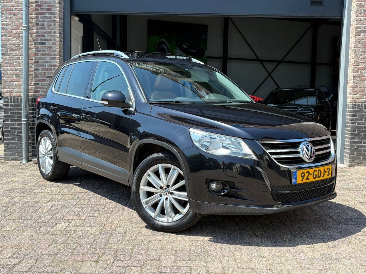 Volkswagen Tiguan 1.4 TSI Sport&Style 4Motion Pano *LEES TEK, Auto's, Gebruikt, 4 cilinders, Zwart, Bedrijf
