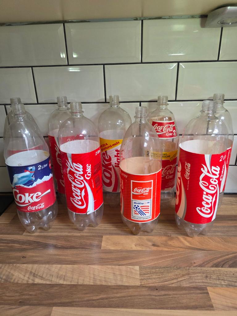9 Vintage Coca-Cola 2L flessen - Diverse edities, Ophalen of Verzenden, Gebruikt