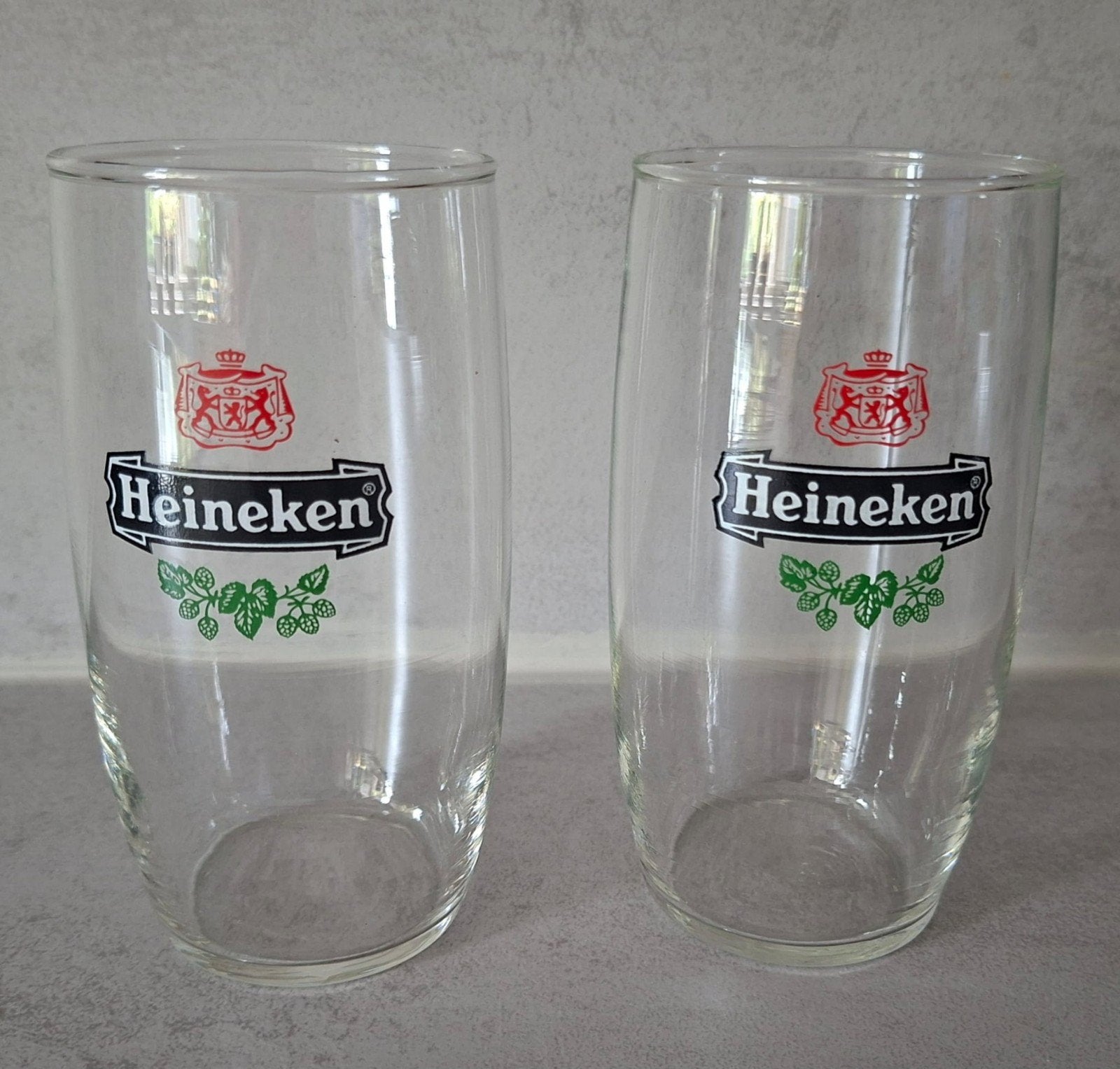 Set van 2 Heineken bierglazen t.e.a.b, Verzamelen, Ophalen of Verzenden, Gebruikt