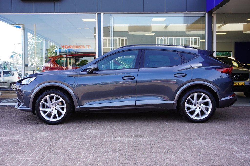Cupra Formentor 1.4 e-Hybrid Business Automaat | Airco | Nav, Auto's, Gebruikt, 4 cilinders, Leder en Stof, Hybride Elektrisch/Benzine