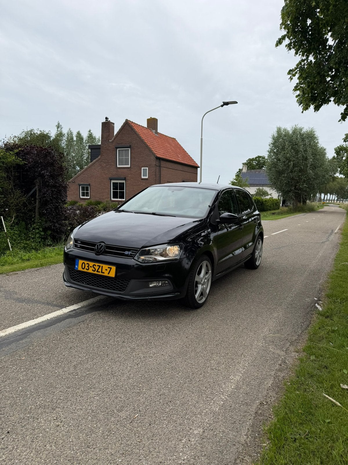Volkswagen Polo 1.2 TSI 66KW 2012 Zwart, Auto's, Euro 5, Stof, 40 €/maand, 4 cilinders