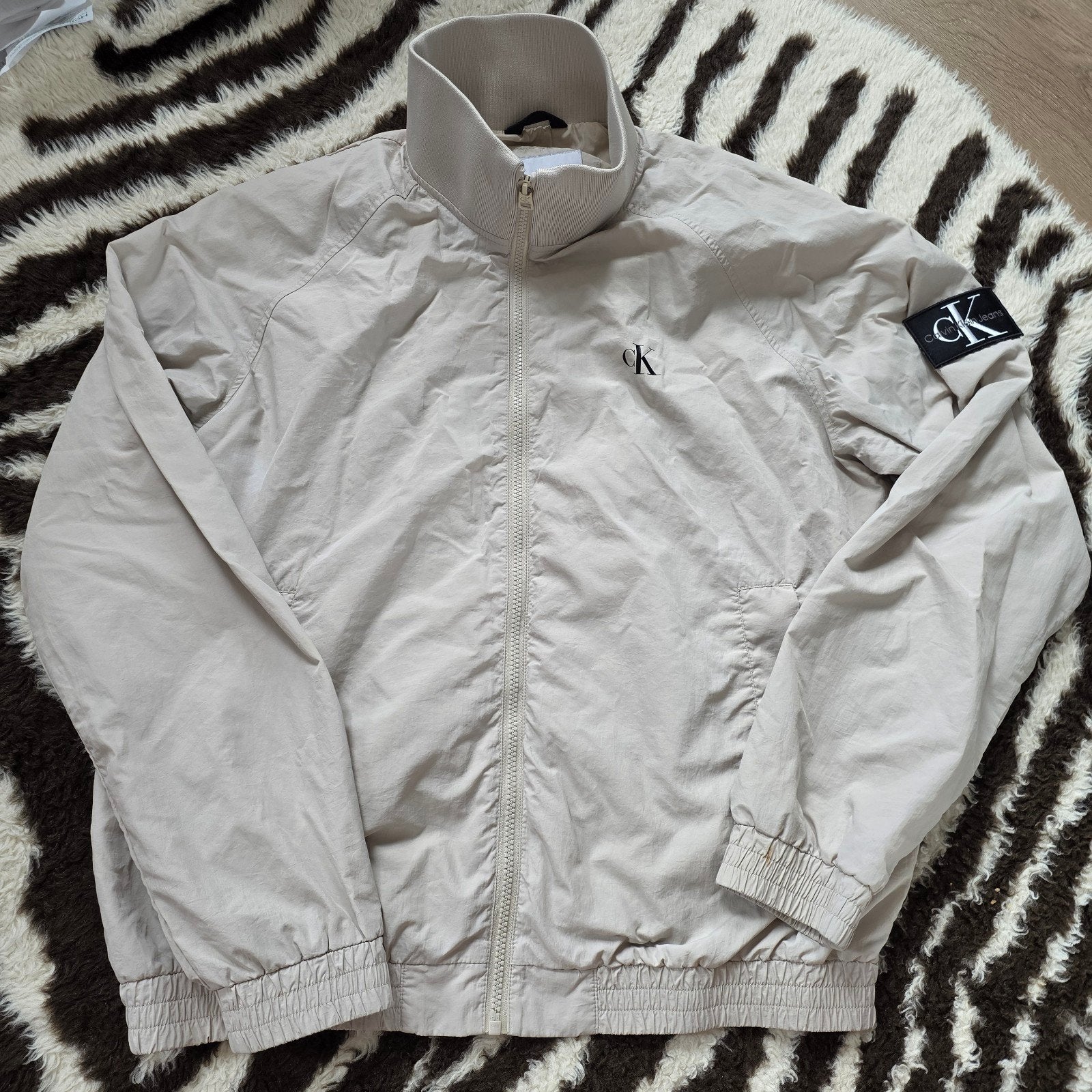Calvin Klein Jeans Windjack Maat L Beige, Maat 52/54 (L), Beige, Ophalen of Verzenden, Gedragen