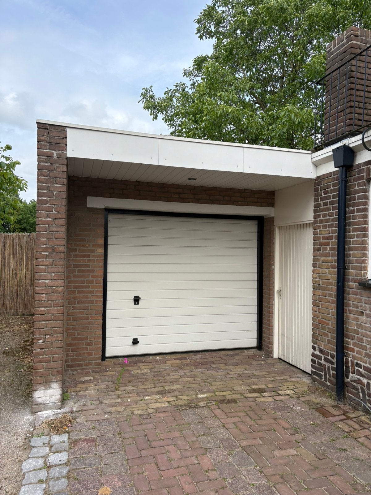 Elektrische geïsoleerde sectionaaldeur / garagedeur wit, Ophalen