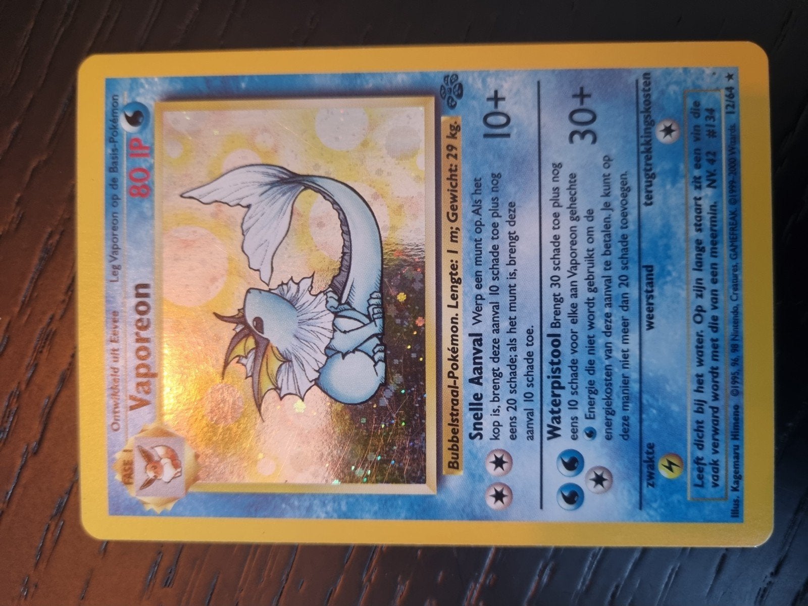 Vaporeon 12/64 jungle NL , holo rare * € 25, Ophalen of Verzenden, Zo goed als nieuw, Losse kaart, Foil