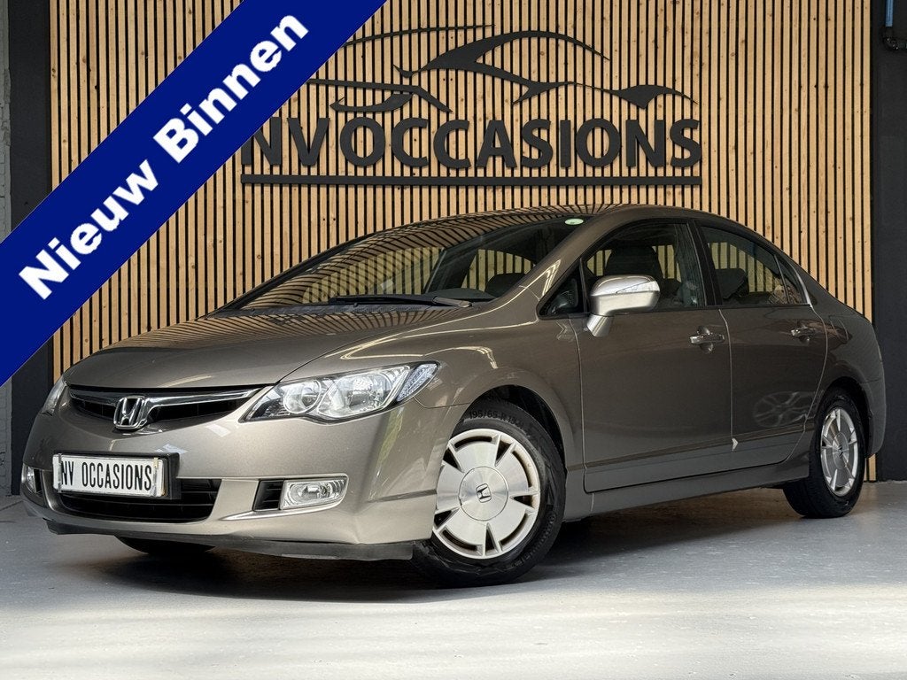 Honda Civic 1.3 Hybrid LEDER/PARKEERSENSR/STOELVW/CRUISE/NAP, Auto's, Honda, Gebruikt, Beige, Hybride Elektrisch/Benzine, 22 km/l