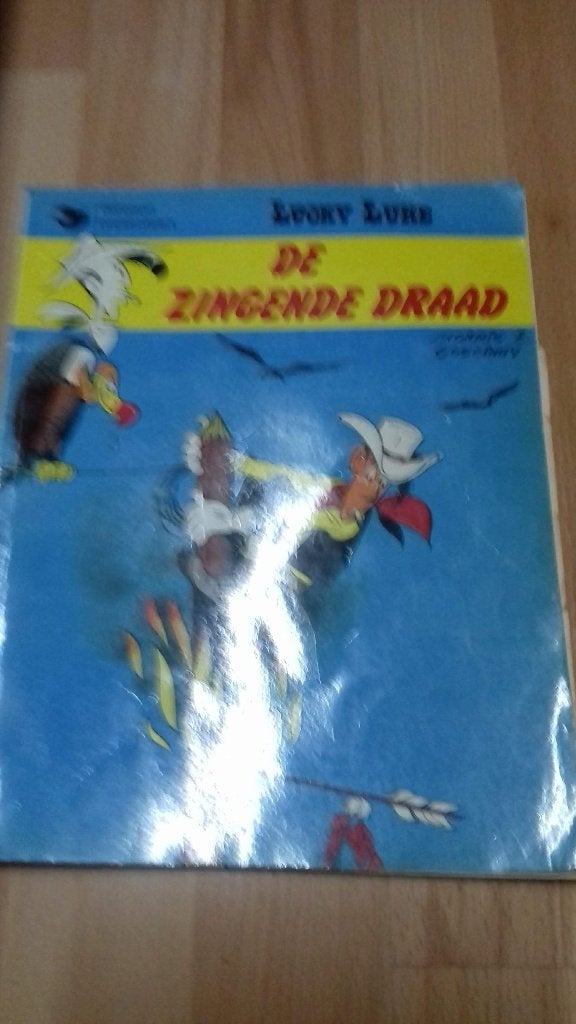 stripboek lucky luke en de zingende draad, Eén stripboek, Ophalen of Verzenden, Gelezen, Morris