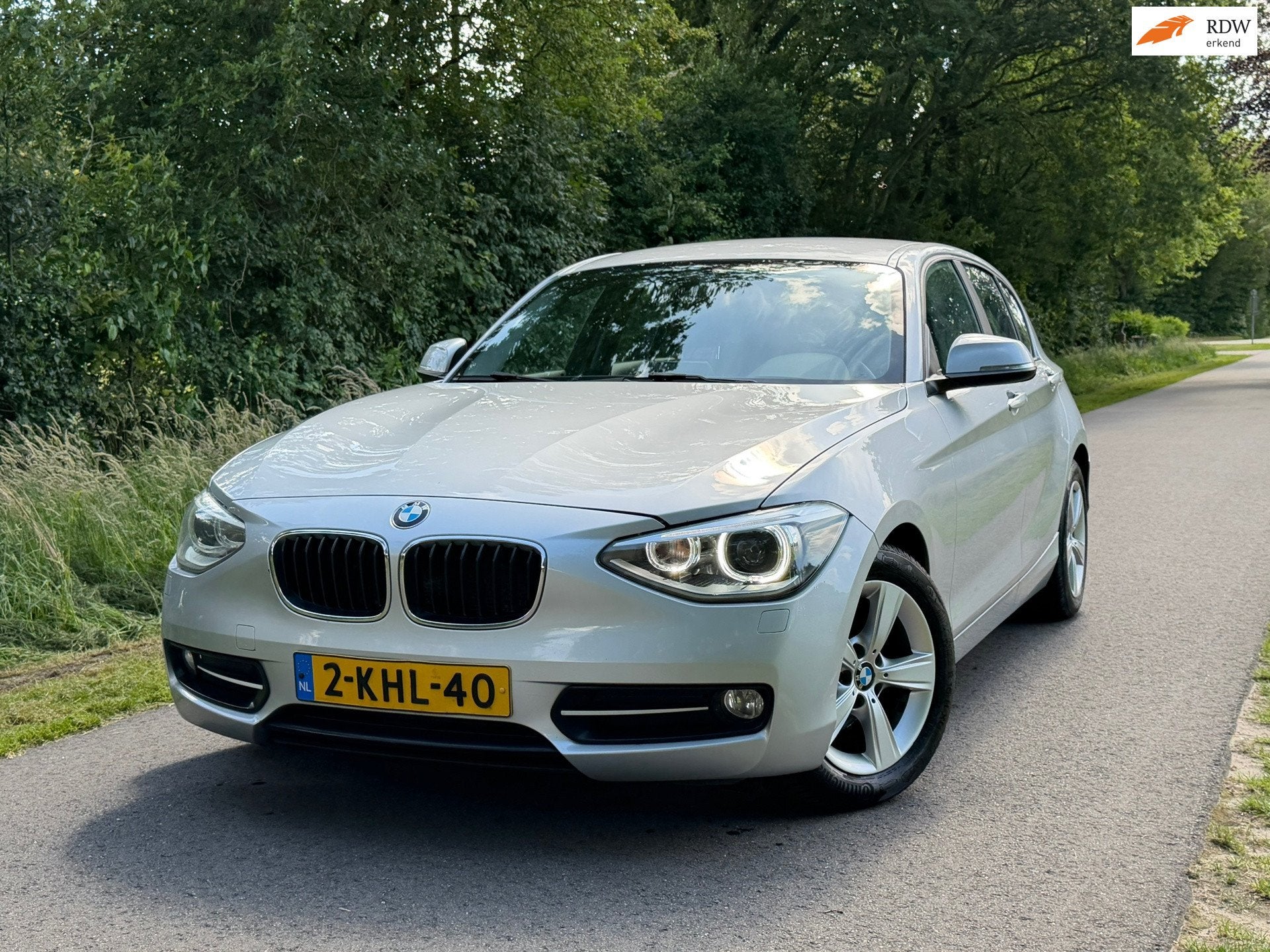 BMW 1-serie 114i EDE Business Sport | Navi + Cruise + Clima, 1-Serie, Start-stop-systeem, Gebruikt, 4 cilinders