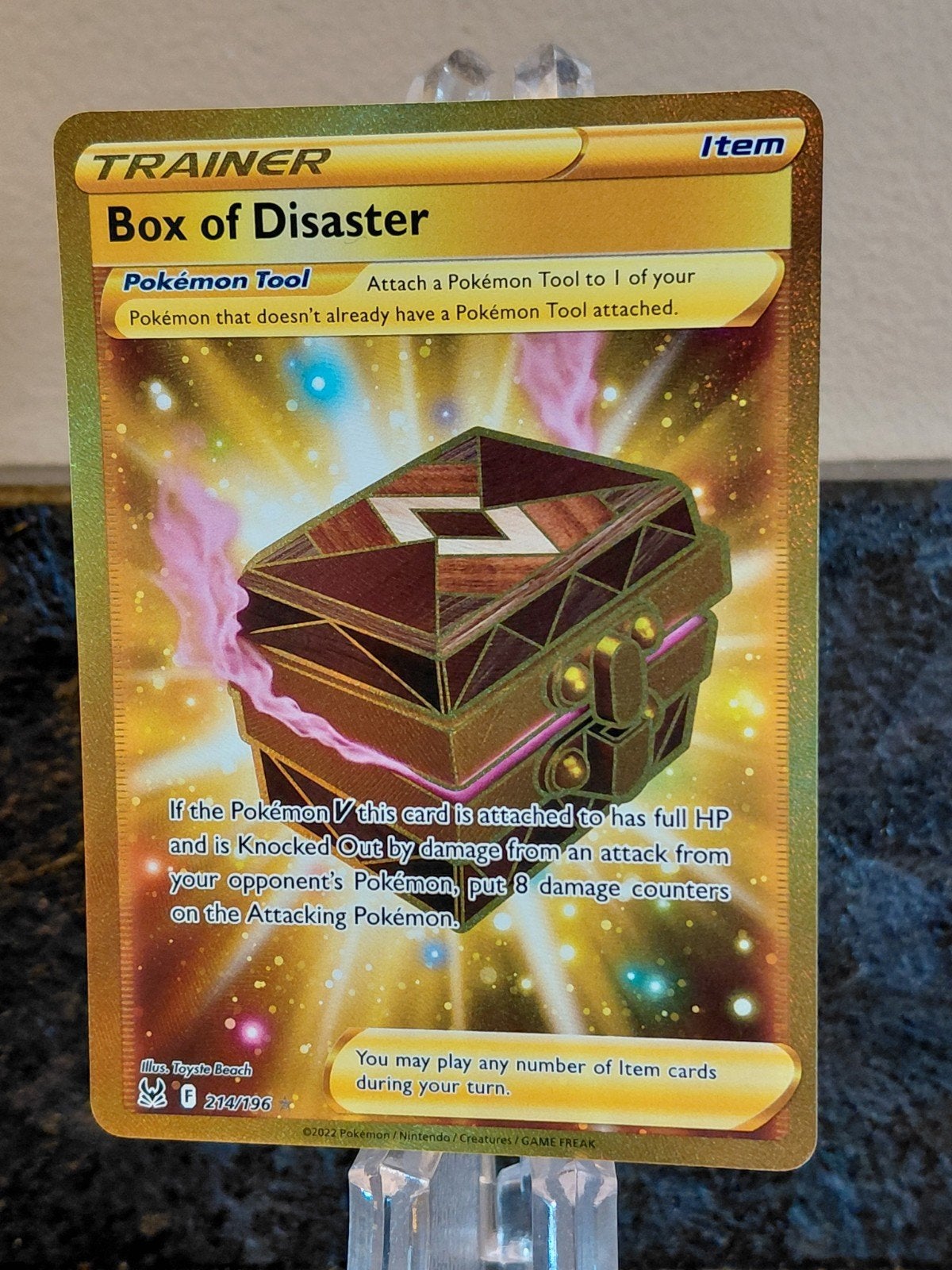 244/196 Box of Disaster Gold Trainer Pokémon Kaart, Ophalen of Verzenden, Zo goed als nieuw, Losse kaart, Foil