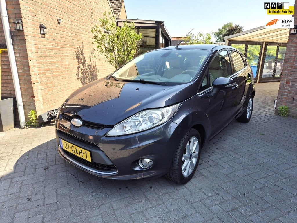 Ford Fiesta 1.25 Ghia 5 Drs Met Clima, Auto's, Stof, 82 pk, Origineel Nederlands, Bedrijf